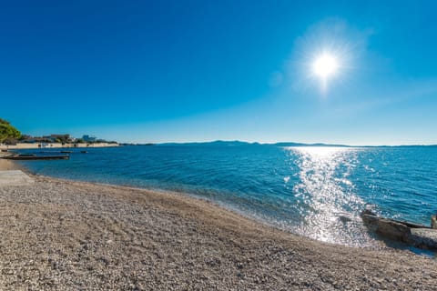 On the beach, sun loungers