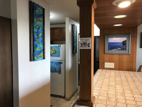 Hallway to kitchen. Island area for additional seating and counter space.