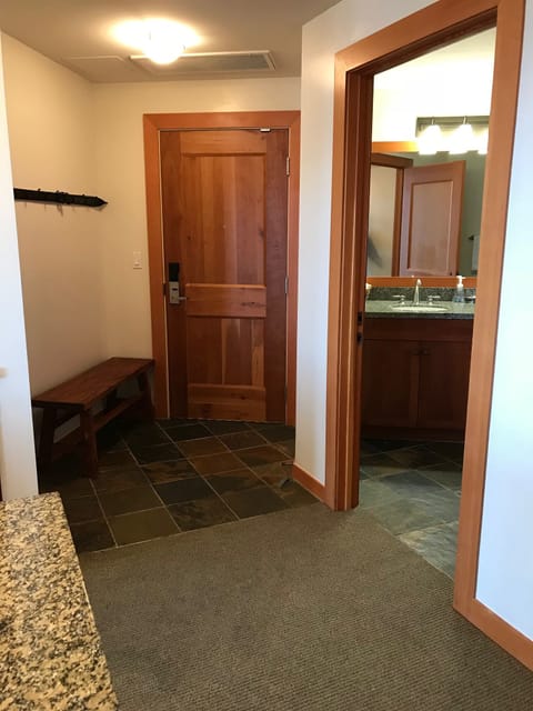 Entrance with bench to put on boots and hangers for coats or other things to dry