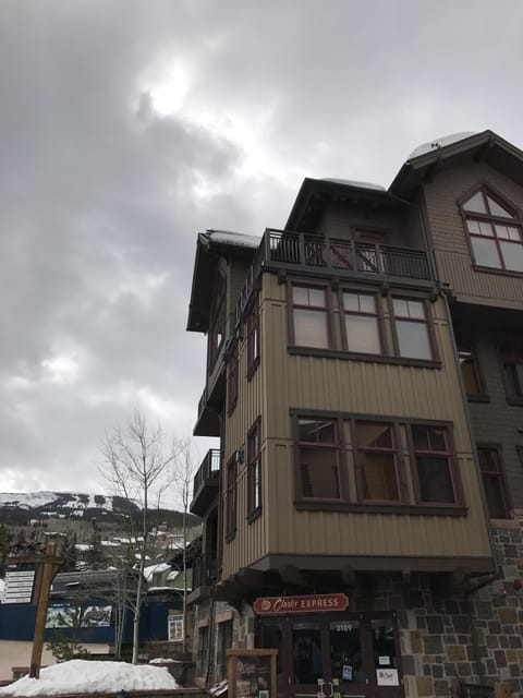 Shows upper penthouse corner unit with two balconies and high ceilings