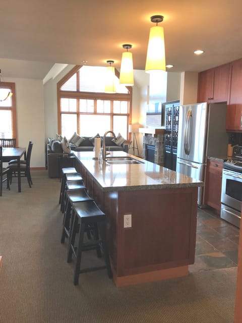 Large open floor plan with kitchen flowing into dining room and living room.