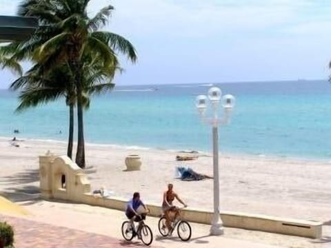 On the beach, sun loungers, beach towels