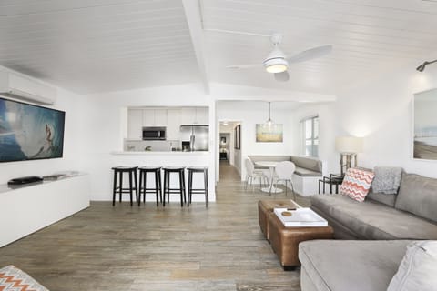 Open living room downstair, dining and kitchen. Comfy couch, 65" TV, DVD Player