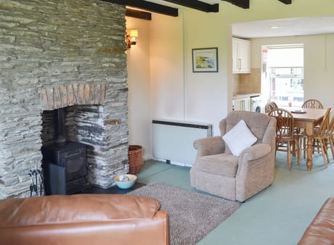 Living area with feature fireplace | Quarrymans Cottage, Edmonton, near Wadebridge