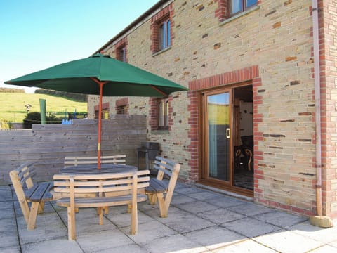 Lovely paved patio area with furniture | Porth View - Higher Lanvean Farm, St Mawgan, near Newquay