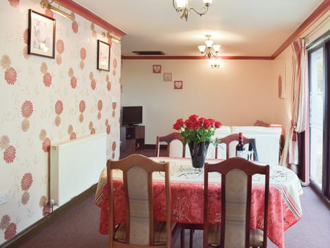 Lovely dining room by the oatio doors affording fine garden views | Elm View - Elm Cottages, Cwmbach, near Whitland