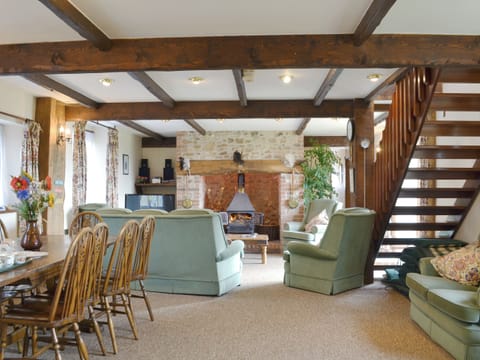 Spacious living/ dining room with beamed ceiling and wood burner | The Granary, Colyford, near Seaton