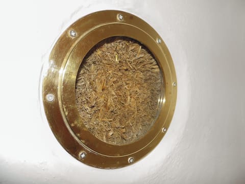 Truth Window. Most strawbale houses have them to demonstrate that behind the lime there is actually straw. | Jill Strawbale House - Strawbale Collection, Strontian, near Fort William