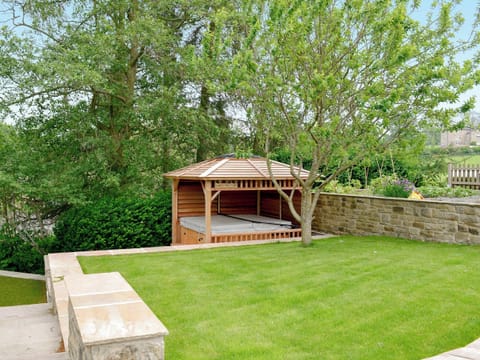 Attractive lawned garden and hot tub | Stirton Burrow, Stirton, near Skipton