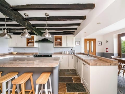 Beamed kitchen diner with electric range cooker | Cote Farm, Langsett, near Penistone