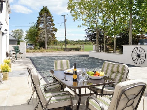 Patio and parking area with stunning rural views | Greengill Farm Holiday Cottage - Greengill, Greengill, near Cockermouth