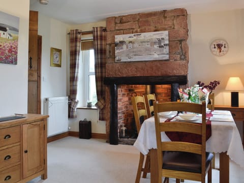 Dining room with wood burner | Rose Cottage - Springfield Farm Cottages, Bigrigg, near Egremont