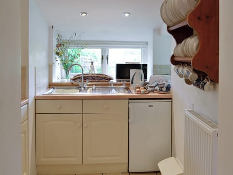 Compact fitted kitchen | Riverside Cottage, Betws-y-Coed