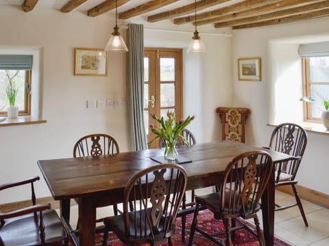 Delightful dining area with beamed ceiling | Bryn Gwnog, Llanrwst, near Betws-y-Coed