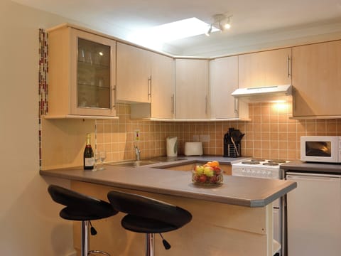 Kitchen and breakfast bar | Cameron Lodge Cottage, Innellan, near Dunoon