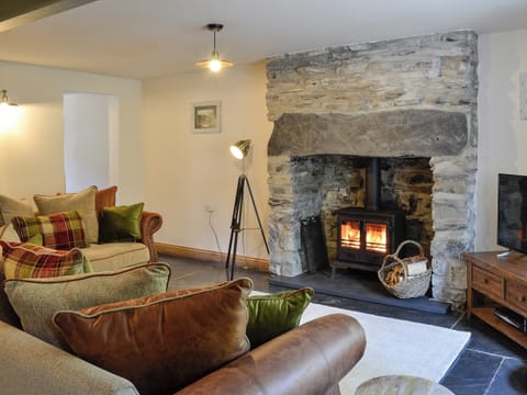 Cosy living room with Wood burning stove | Maybill Cottage, Cwm Penmachno, near Betws-y-Coed