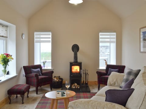 Cost living room with wood burner | Kilbride Beach Cottage, near Lochboisdale, Isle of South Uist