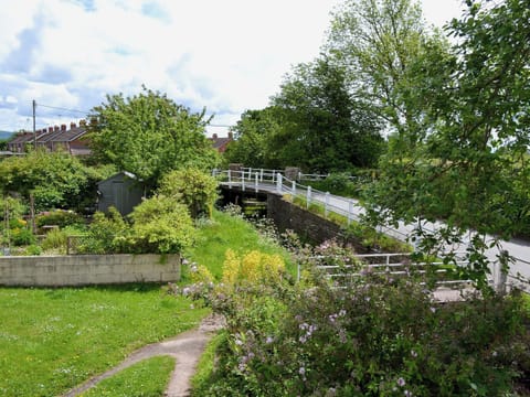 Large enclosed, lawned garden with fruit trees, summer house and furniture | Brook Cottage, Eardisley