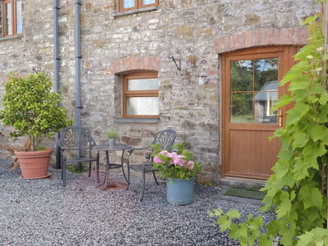 Gravelled patio area | Mill Cottage - Pendegy Mill, Llanybri, near Carmarthen