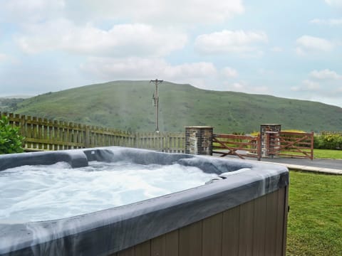 Relaxing hot tub with far reaching views | Eithinog - Tynrhelyg Cottages, Talybont, near Aberystwyth