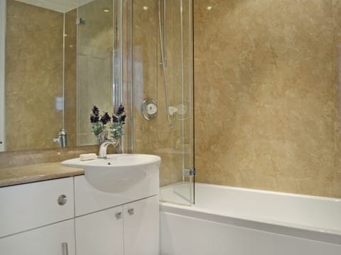 Bathroom with shower over bath | Summerlea Cottage, Moffat