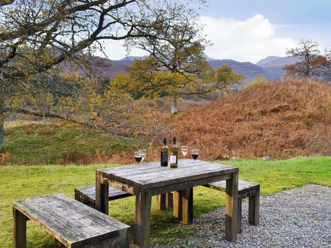 large unfenced rear garden with furniture | Coulags Croft, Coulags, Strathcarron