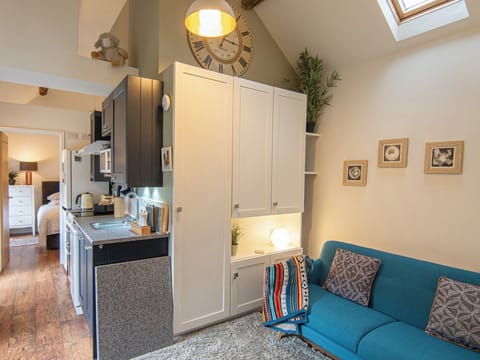 Bright and airy living room with high beamed ceilings, log burning stove and TV | Bailey’s Barn, Bonsall, near Matlock