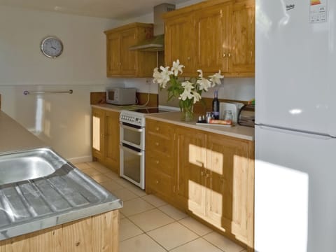 Galley style kitchen | Granny Bond&rsquo;s Farmhouse - Craneham Farm, Buckland Brewer