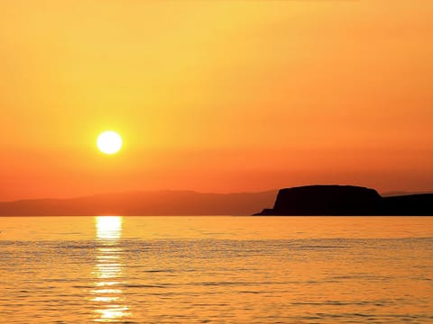 Spectacular sunsets can be enjoyed | Charlie’s Cottage, Muasdale, near Campbeltown