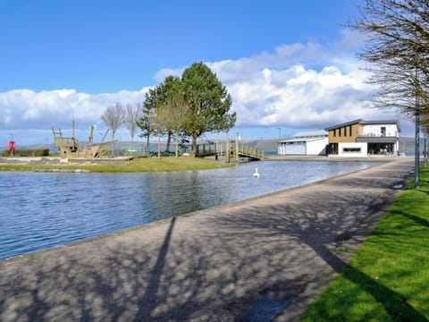Agnew Park with a pond, café and the sea beyond | Park View Cottage, Stranraer