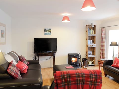 Spacious open plan living area with doublr sofa bed and wood burner | The Cottage - Rispond Estate, Rispond, near Durness