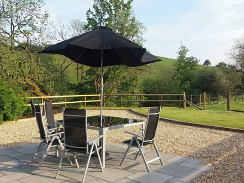 Patio area with glorious views of the surrounding area | Riverside Cottage, Boreland, near Lockerbie