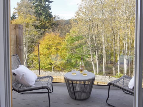 Double doors from living area lead onto the balcony | Kenmore Lodge, Balnaskeag, near Kenmore