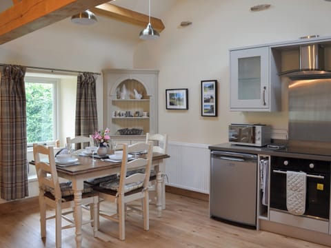 Elegant dining area and adjacent kitchen | Brow View Cottage, Ravenstonedale, near Kirkby Stephen