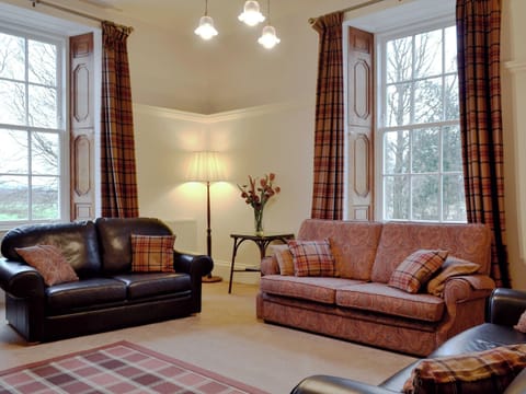 Characterful living room with high ceiling and large windows | The Factor’s House, Kilmartin Glen, near Lochgilphead