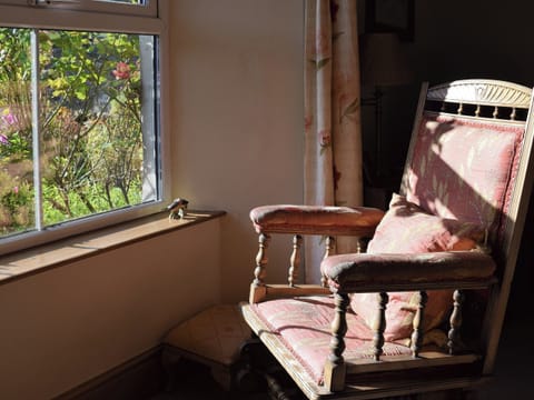 Seat in living room overlooking garden | Harriet’s Cottage, Muker near Reeth