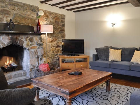 Living room with open fire | Old Tan Rhiw, Beddgelert