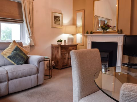 Living room with dining area | 9 Howrah’s Court - Greta Grove Apartments, Keswick