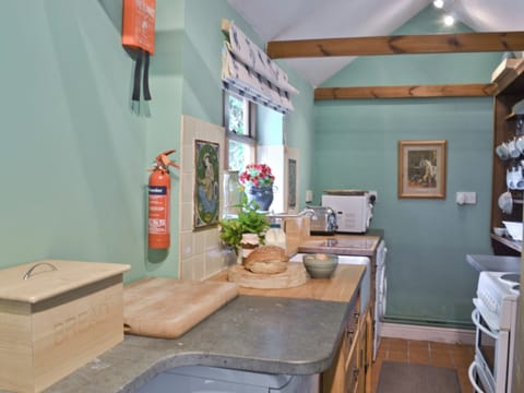 The cottage has a well equipped galley style kitchen | The Coach House - Berrington House, Tenbury Wells