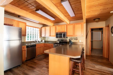 Kitchen with all the supplies you need: Gas Stove, Coffee Maker, Crockpot etc.