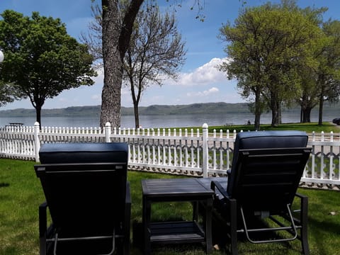view of the lake from the chaise lounges