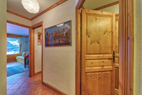 Hallway leading from living room to bedrooms and bathroom.