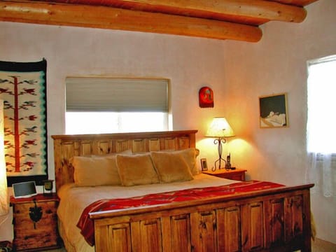 King guest bedroom showing viga ceilings