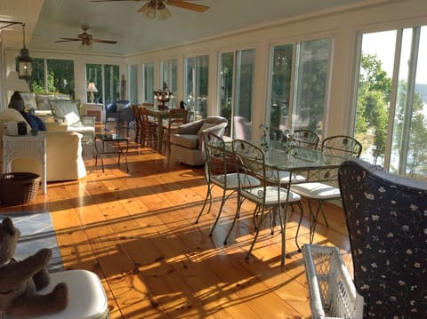 Here is the 44 foot porch where guests relax at Beckoning Bay Cottage