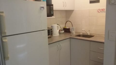 Fridge, microwave, electric kettle, toaster