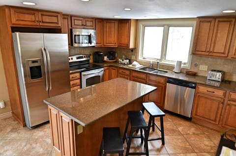 Fully Equipped Kitchen - Newly remodeled, fully equipped kitchen with an open dining room area.