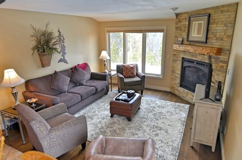 Living Room Area - Newly remodeled living room area with a cozy fireplace and TV.
