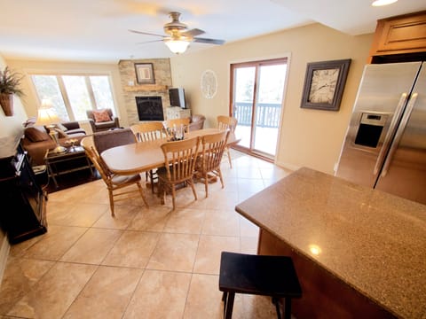 Main Level - The main level has a spacious and very open feel. The fully equipped kitchen is open to the dining area and living room. Relax on the large patio that sits off of the main level.
