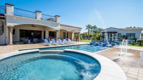 Outdoor paradise w/ lounge chairs, pool, spa, splash pad, & games