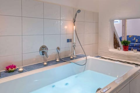 Combined shower/tub, jetted tub, hair dryer, bidet